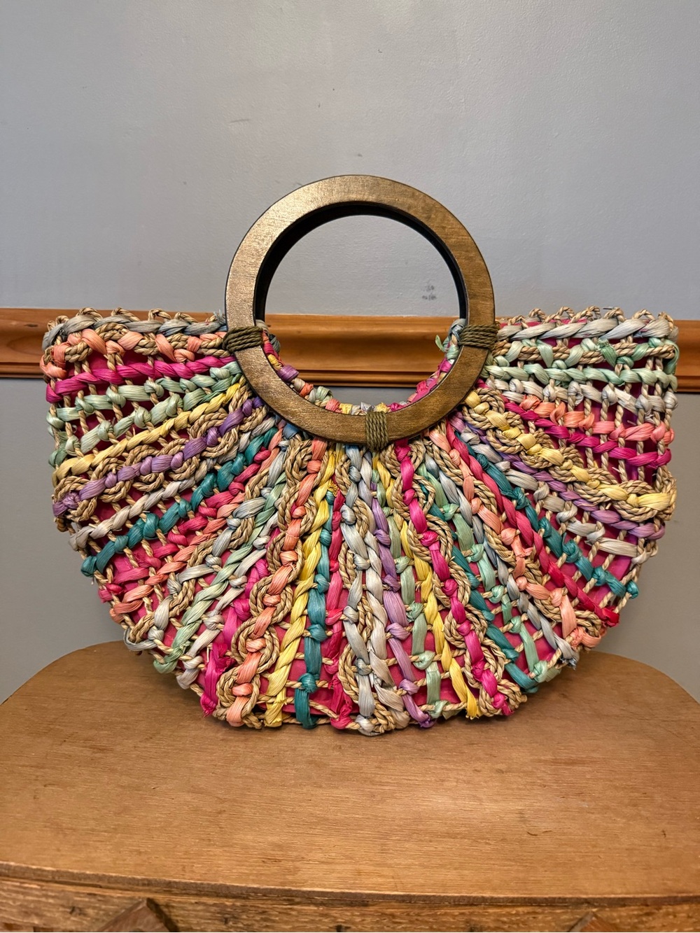 Cappelli Straworld Inc. vintage multi-color woven straw crescent handbag